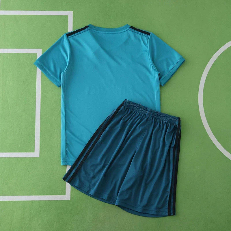 Real Madrid CF Third Retro Kids Kit 2017/18 – Children's Teal Football Jersey & Shorts Set with Pixel Block Design