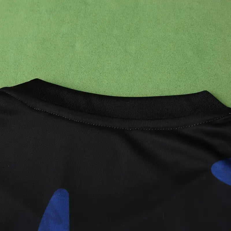 Manchester United Training Shirt Fan Version 2024/25 – Black Red Blue Geometric Tezos Pre-Match Top
