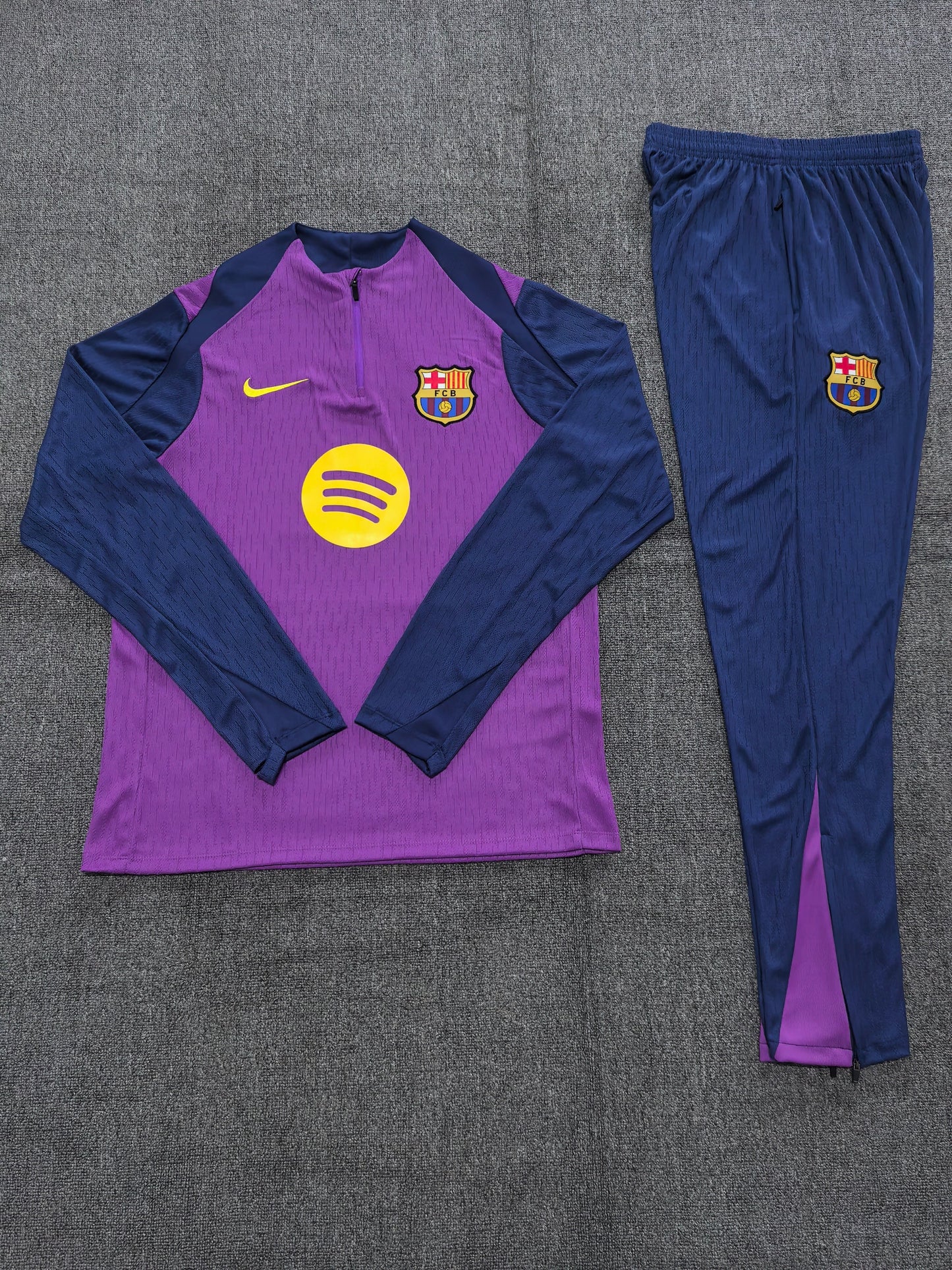 2025/26 FC Barcelona Kids Training Tracksuit Set -  Purple Body Navy Blue Sleeve & Shoulder Panels - Quarter-Zip - Yellow Nike Swoosh - FCB Crest - Spotify Yellow Sponsor - Navy Blue Pants Purple Side Panels