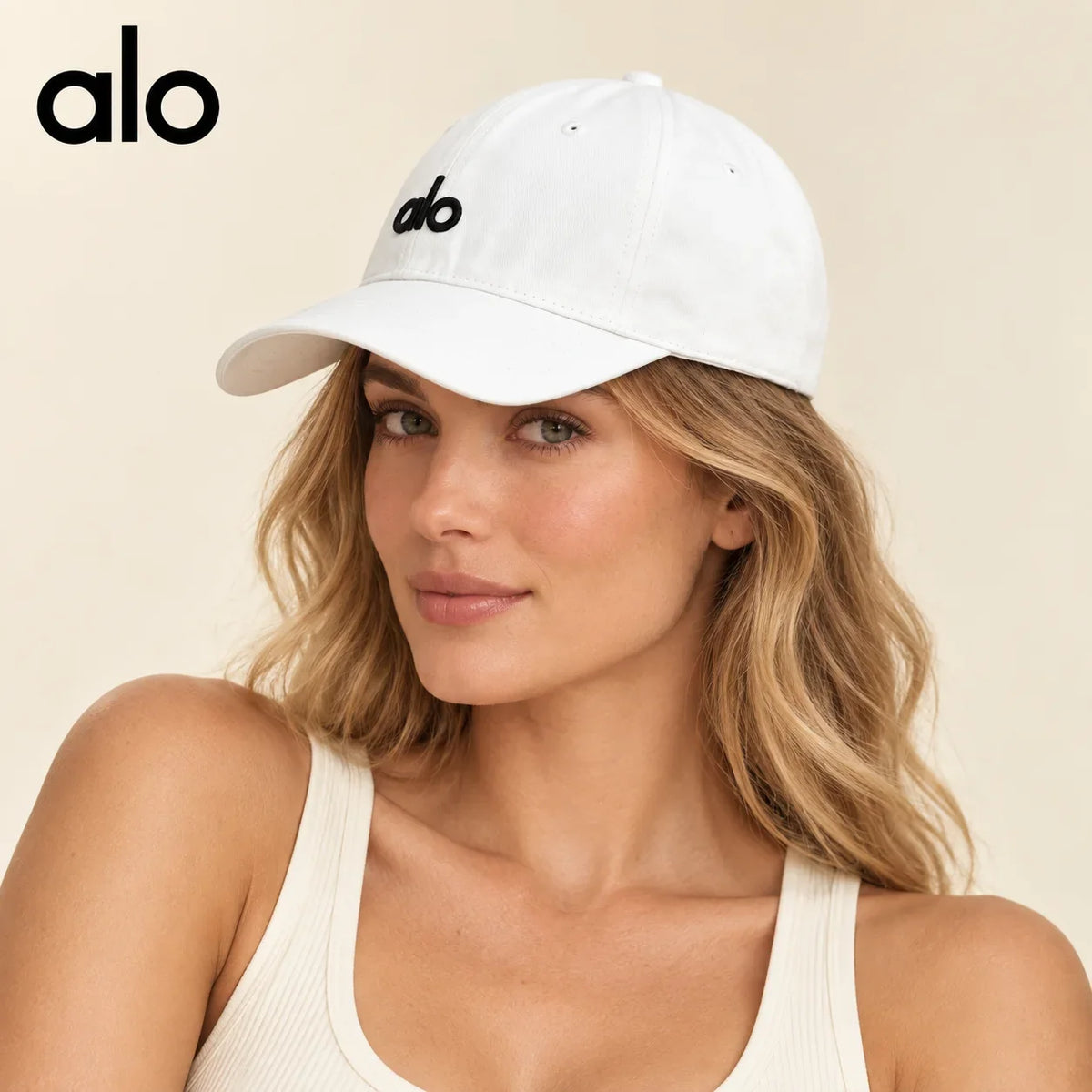 Model wearing alo baseball cap on head