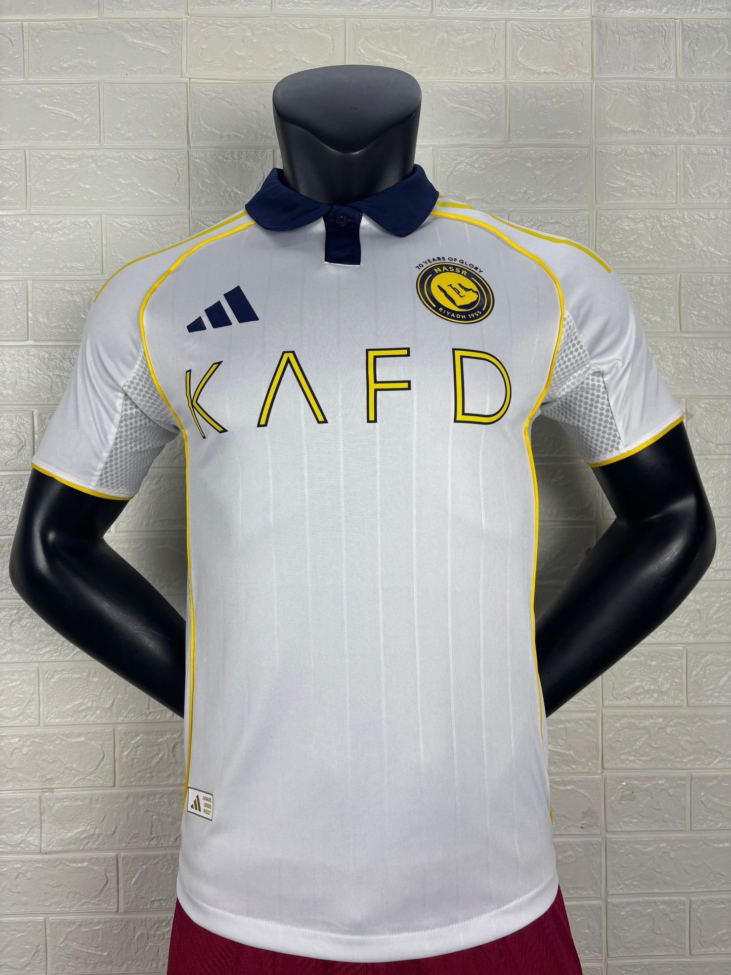 2025/26 Al-Nassr Away Player Version Jersey - White Body - Dark Navy Blue Polo Collar - Gold Yellow Side Seam Piping - KAFD Gold Yellow Sponsor