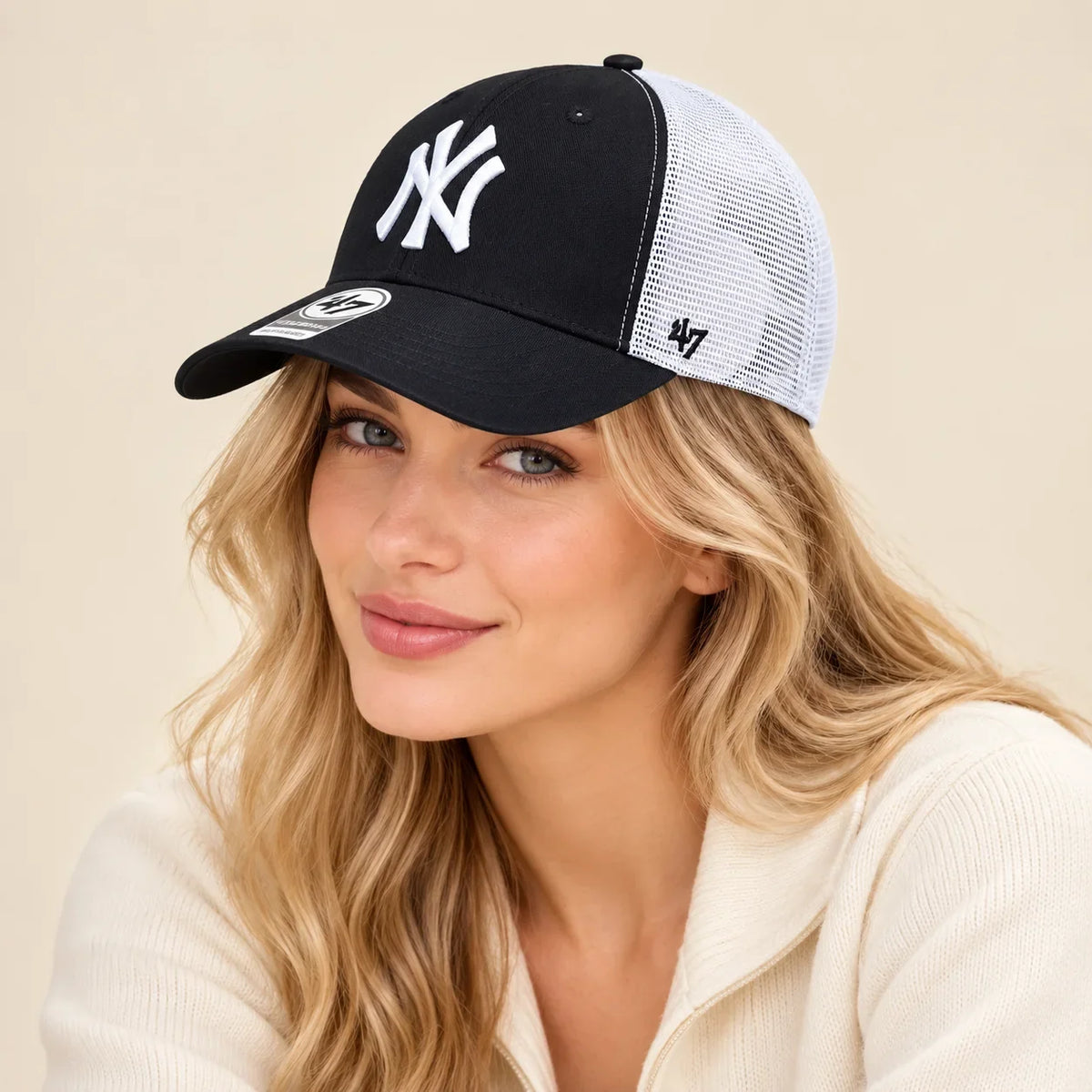 Model wearing baseball cap on head