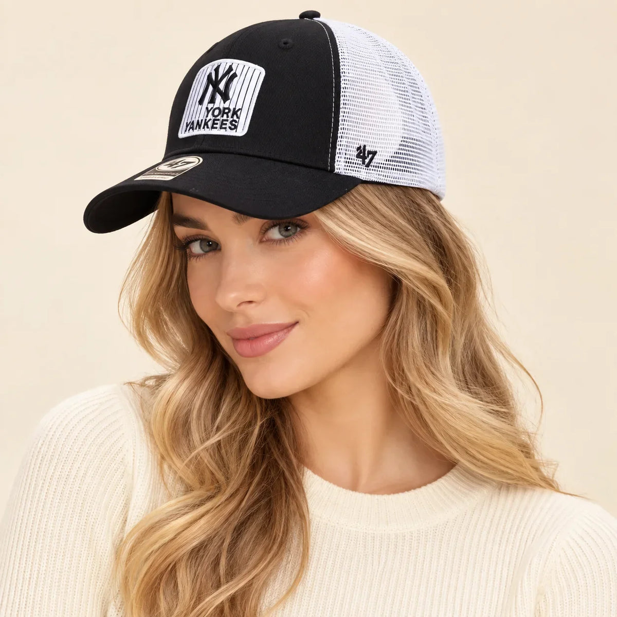 Model wearing baseball cap on head