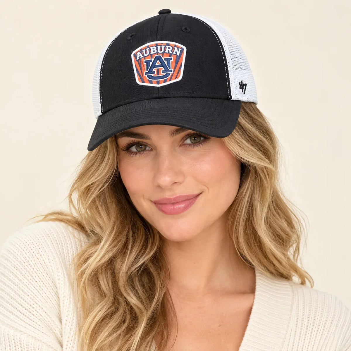 Model wearing baseball cap on head