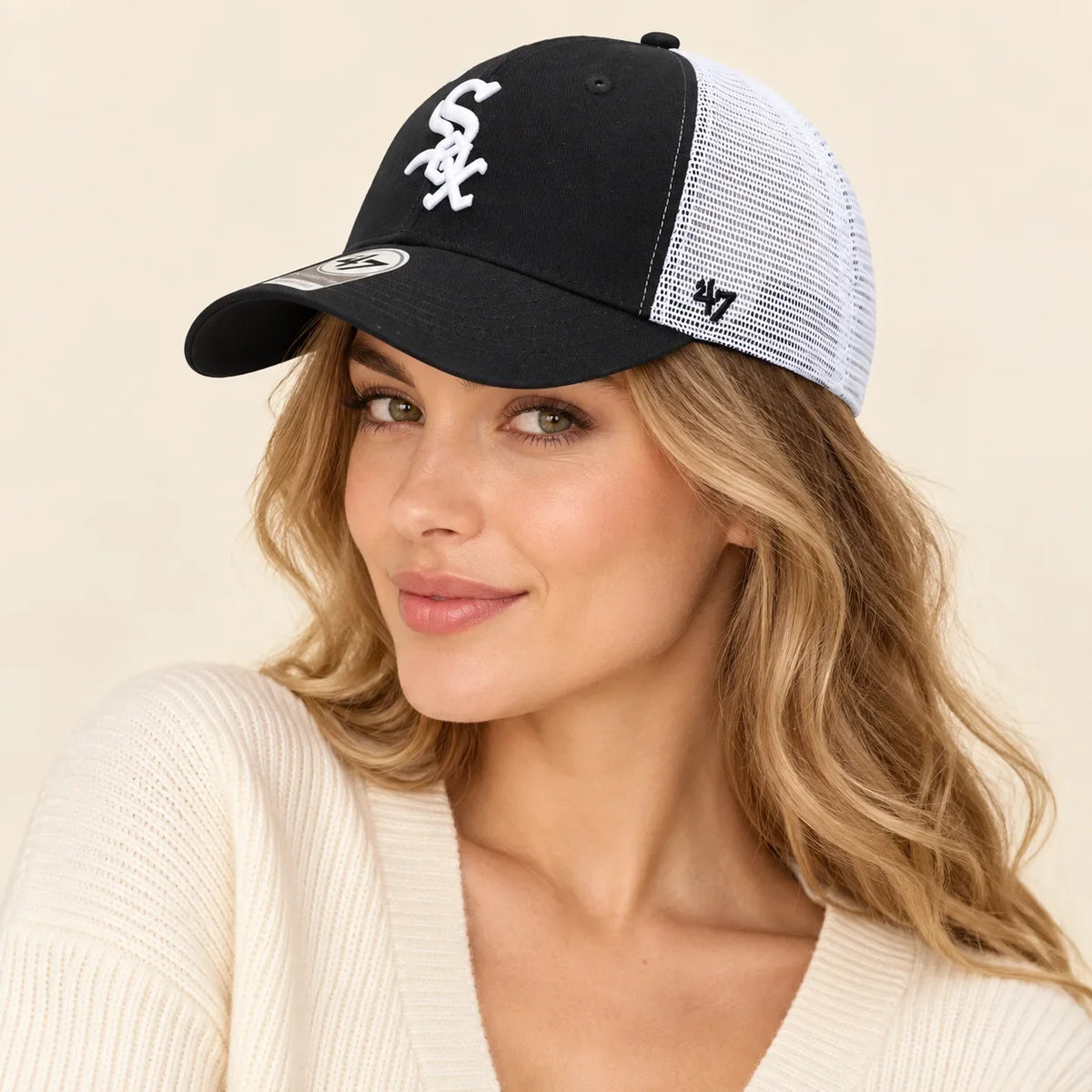 Model wearing baseball cap on head