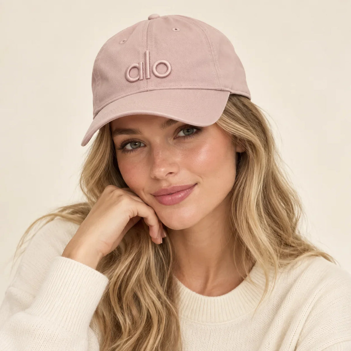 Model wearing baseball cap on head