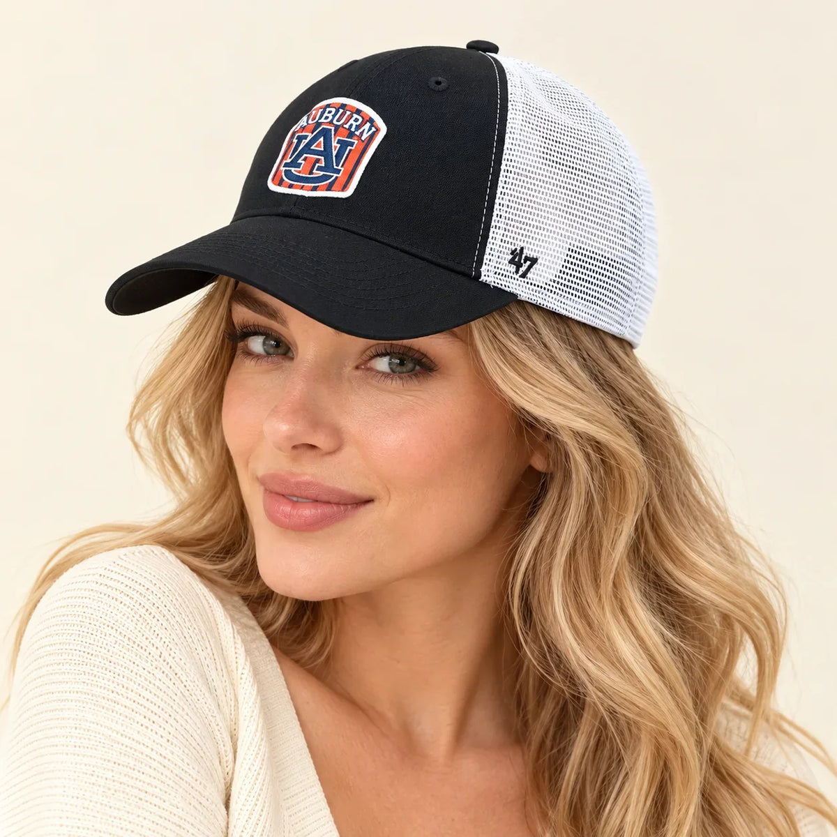 Model wearing baseball cap on head