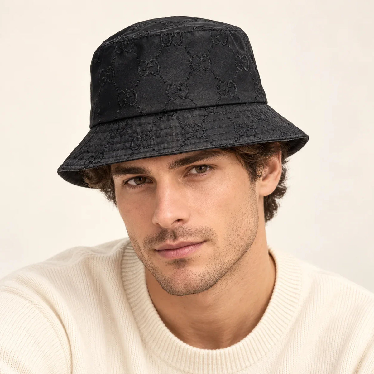 Model wearing bucket hat on head