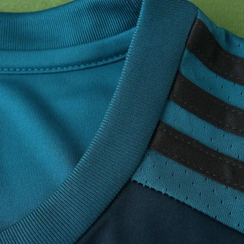 Real Madrid CF Third Retro Fan Version Jersey 2017/18 – Teal Football Shirt with Navy Pixel Block Design