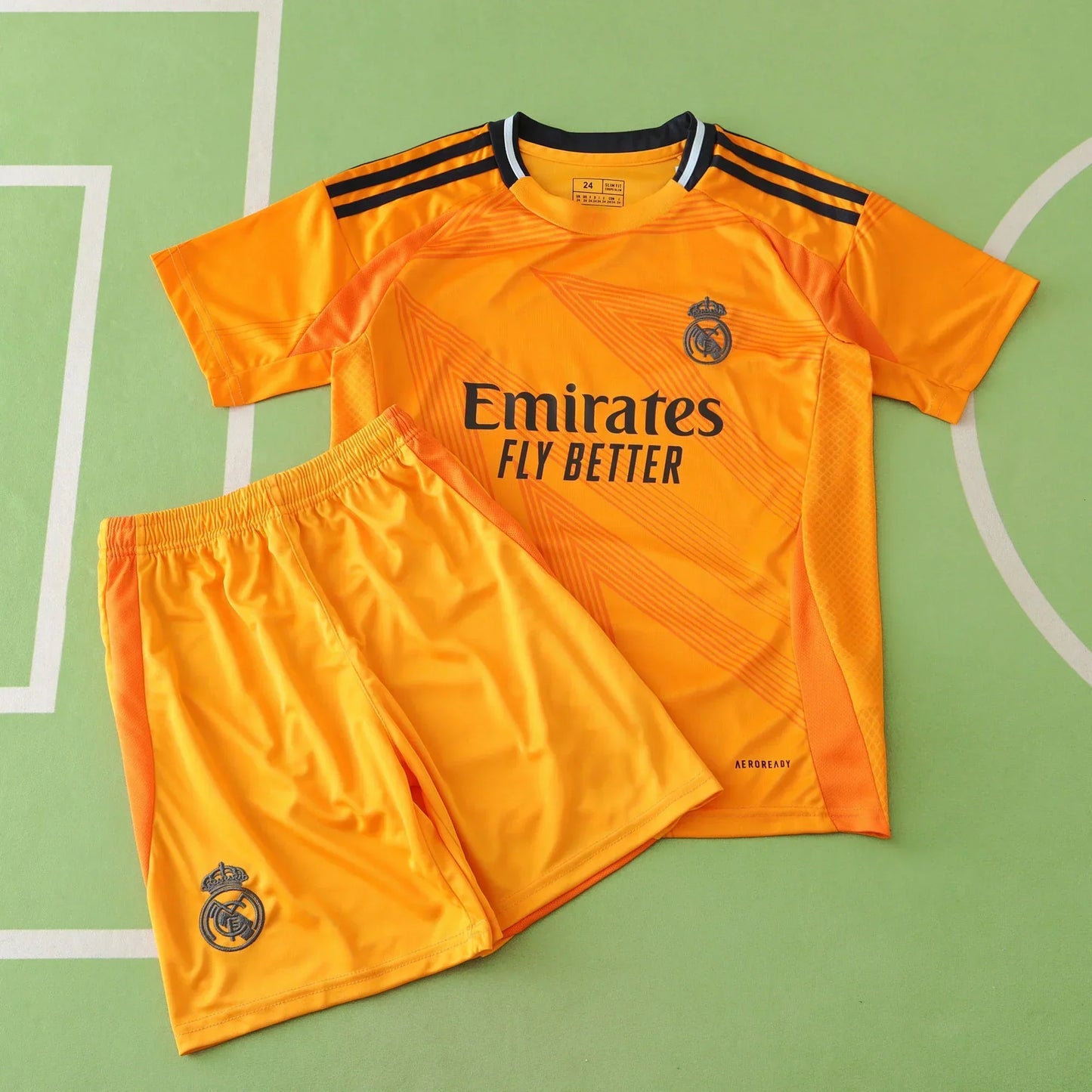 Real Madrid CF Away Kids Kit 2024/25 – Orange & Black Adidas Children's Football Jersey | Mbappé Bellingham Vini Jr. Youth La Liga Kit