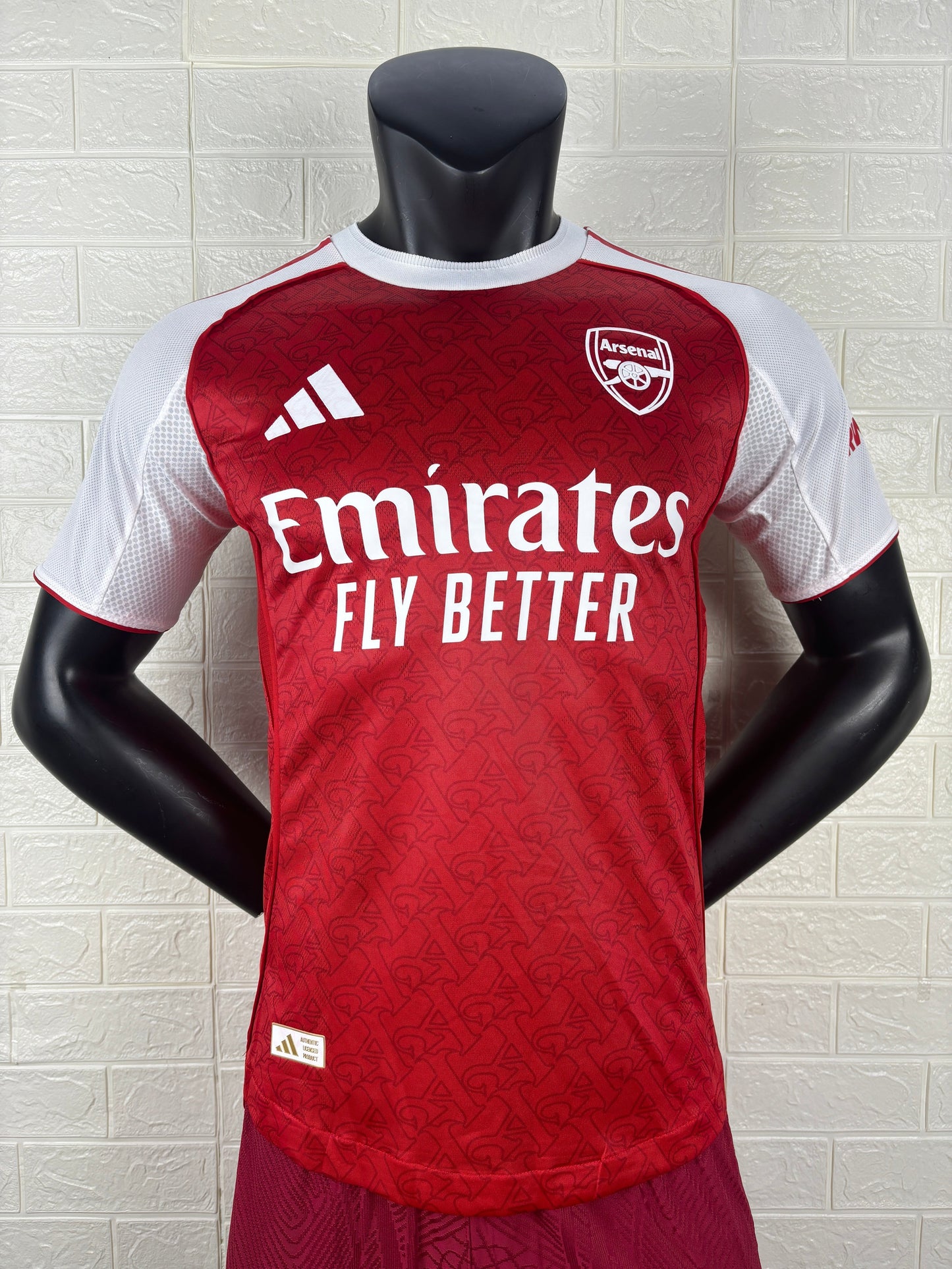 2025/26 Arsenal Home Player Version Jersey - Red Body White Sleeves Diamond Mesh Texture Red Side Seam Piping - White Three Stripes Left Chest - Arsenal Shield Crest Right Chest - Emirates Fly Better Principal Sponsor