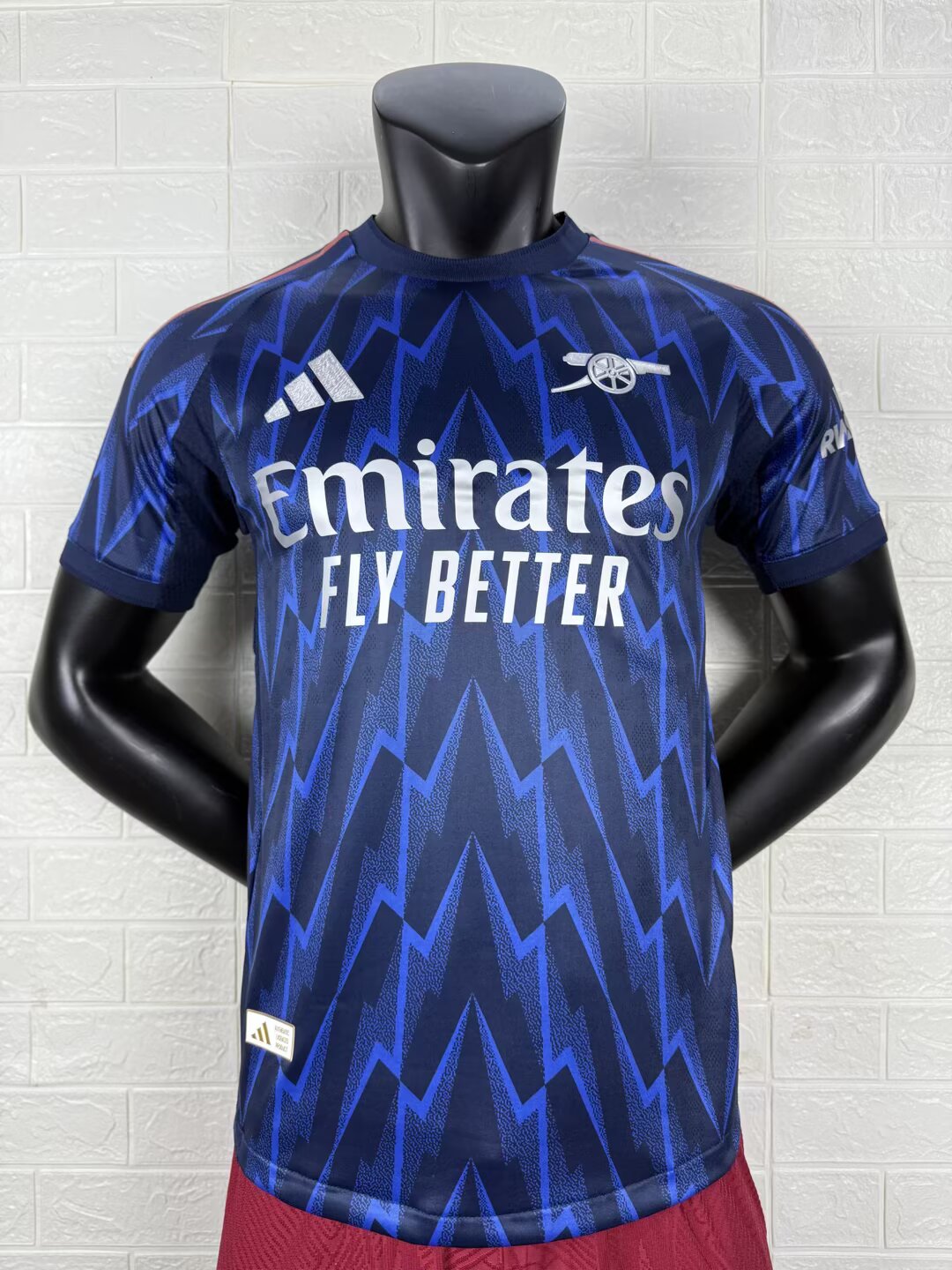 2025/26 Arsenal Away Player Version Jersey - Dark Navy Blue Body All-Over Blue Lightning Bolt Zigzag Graphic - White Three Stripes - Arsenal Cannon Crest - Emirates Fly Better Principal Sponsor