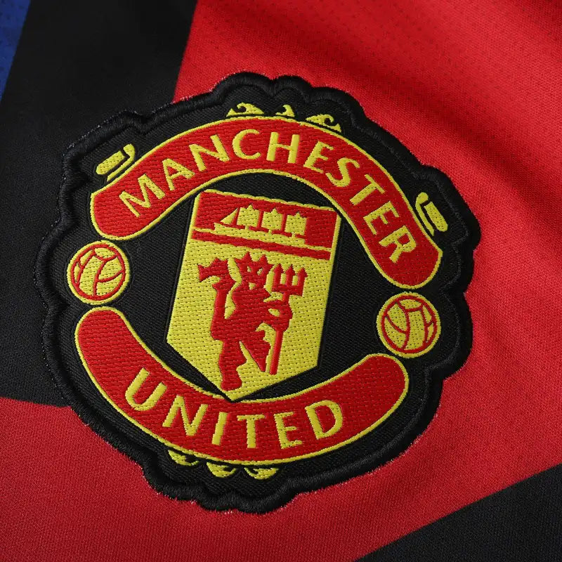 Manchester United Training Shirt Fan Version 2024/25 – Black Red Blue Geometric Tezos Pre-Match Top
