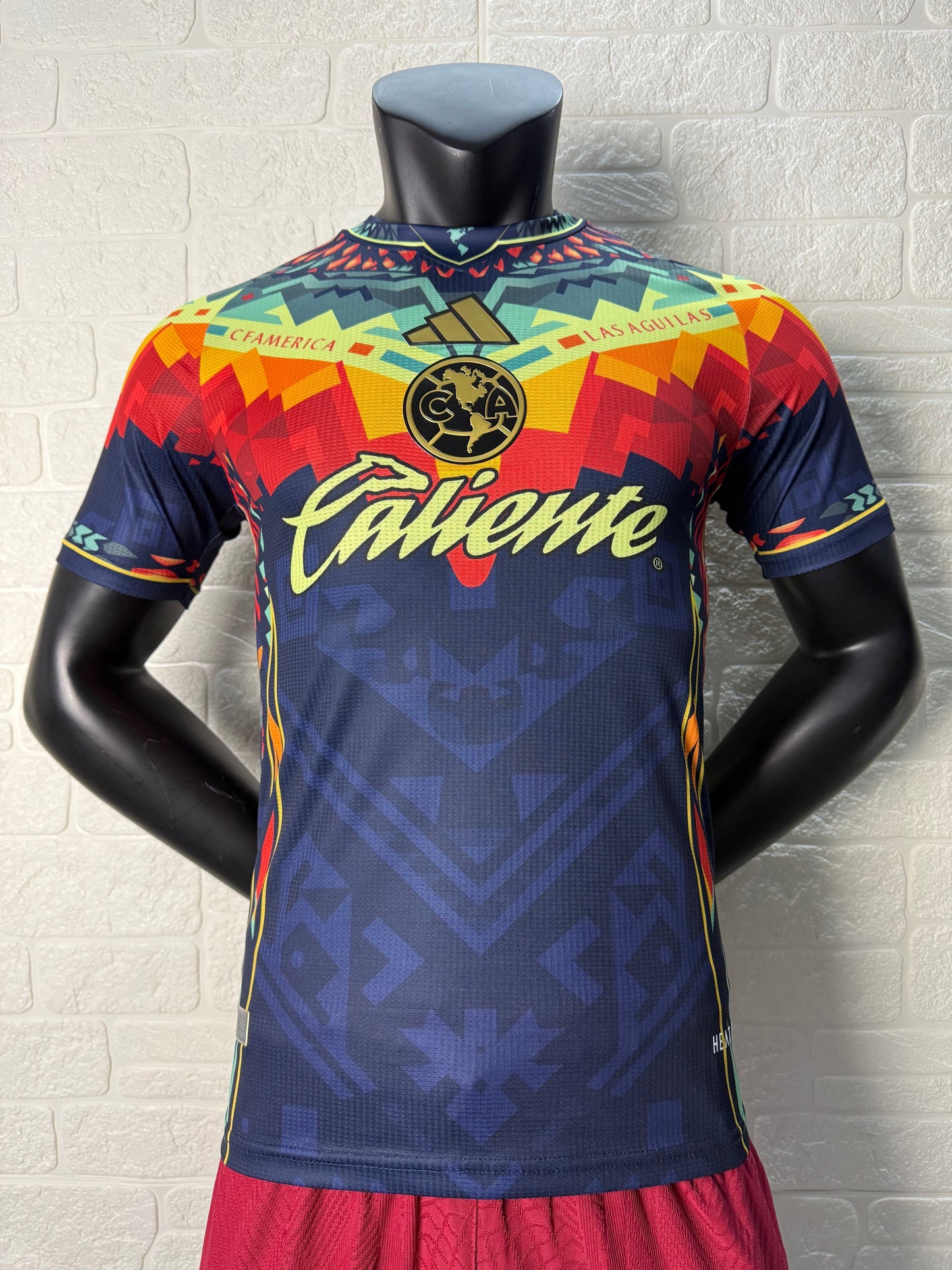 2025/26 Club América Training Player Version Jersey - Dark Navy Blue Body Multicolour Aztec Zigzag Graphic Upper Chest -Gold Three Stripes - Club América Crest - Caliente Principal Sponsor