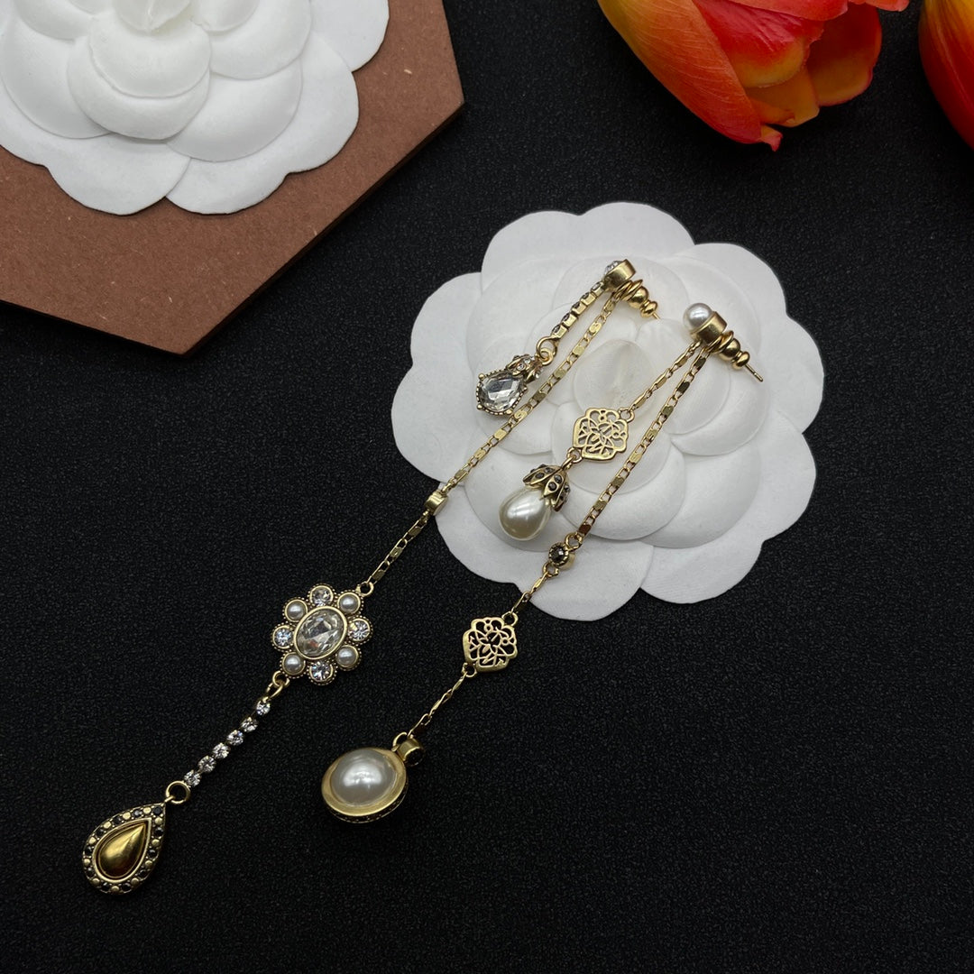 Alexander McQueen Crystal Charm Long Drop earrings in Gold Tone, detail view 2