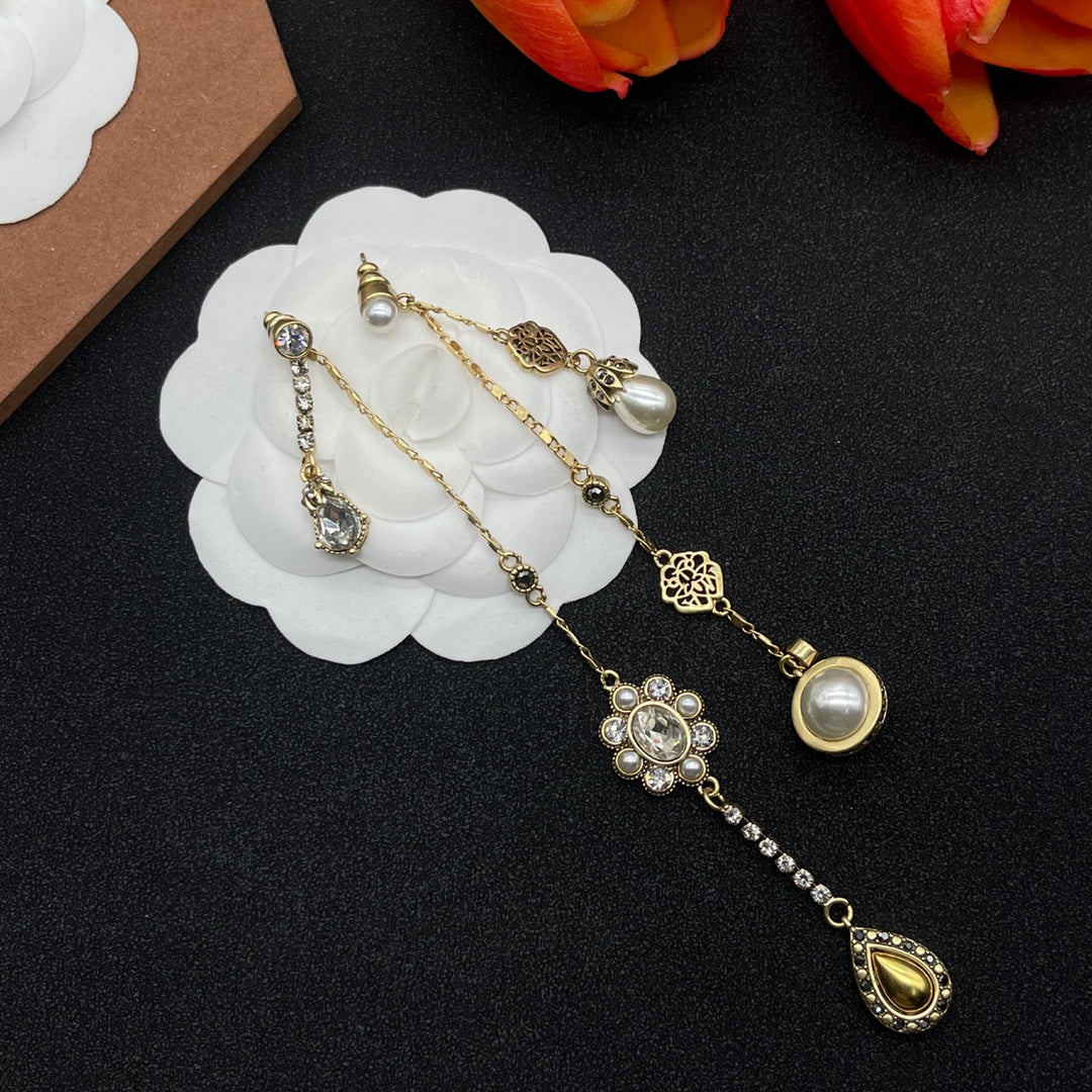 Alexander McQueen Crystal Charm Long Drop earrings in Gold Tone, main view