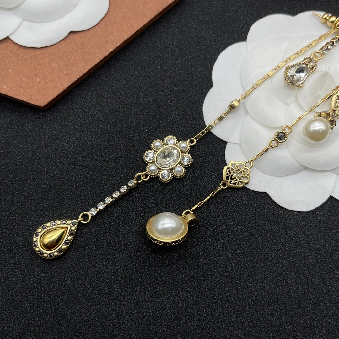Alexander McQueen Crystal Charm Long Drop earrings in Gold Tone, detail view 5