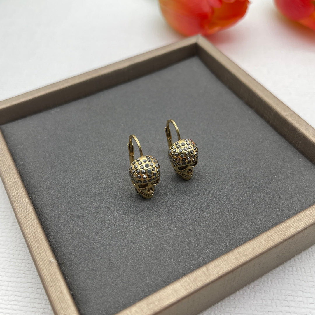 Alexander McQueen Compact Logo Stud earrings in Gold Tone, detail view 2