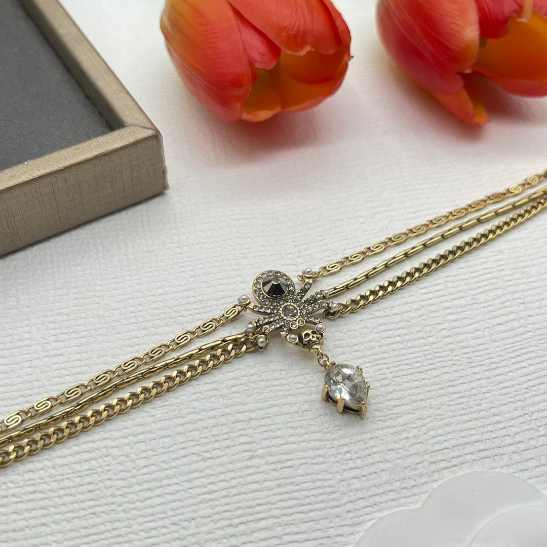 Alexander McQueen Fine Chain Skull bracelet in Gold Tone, detail view 10