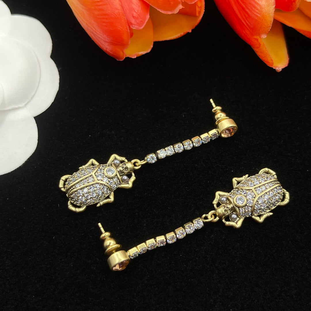 Alexander McQueen Filigree Insect Drop earrings in Gold Tone, detail view 3