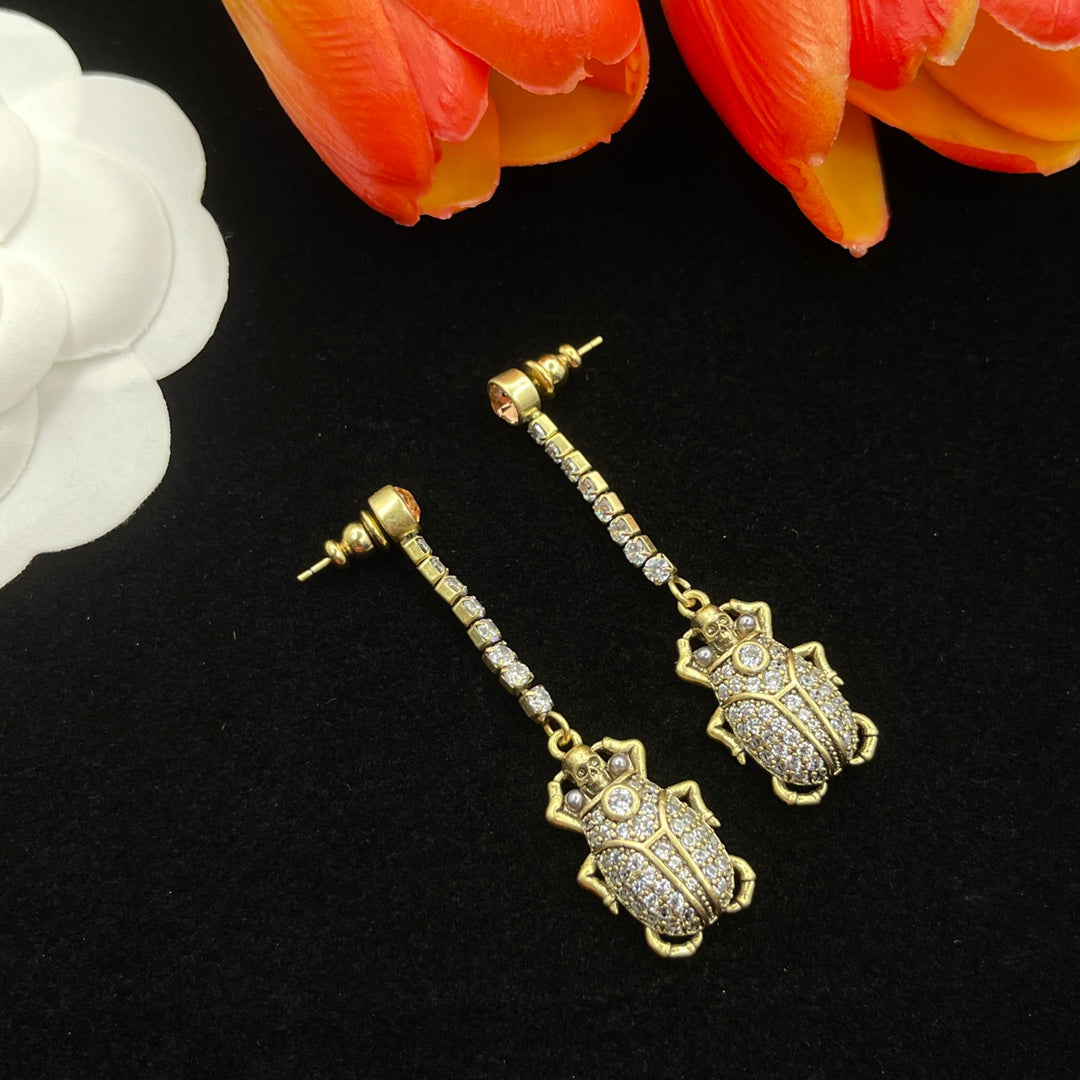 Alexander McQueen Filigree Insect Drop earrings in Gold Tone, detail view 2