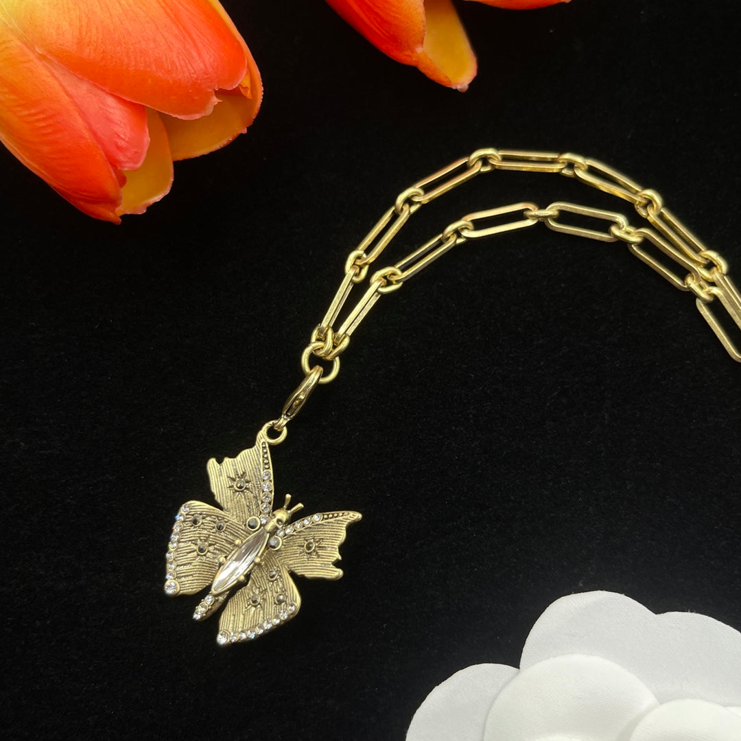 Alexander McQueen Butterfly Charm Chain necklace in Gold Tone, detail view 3
