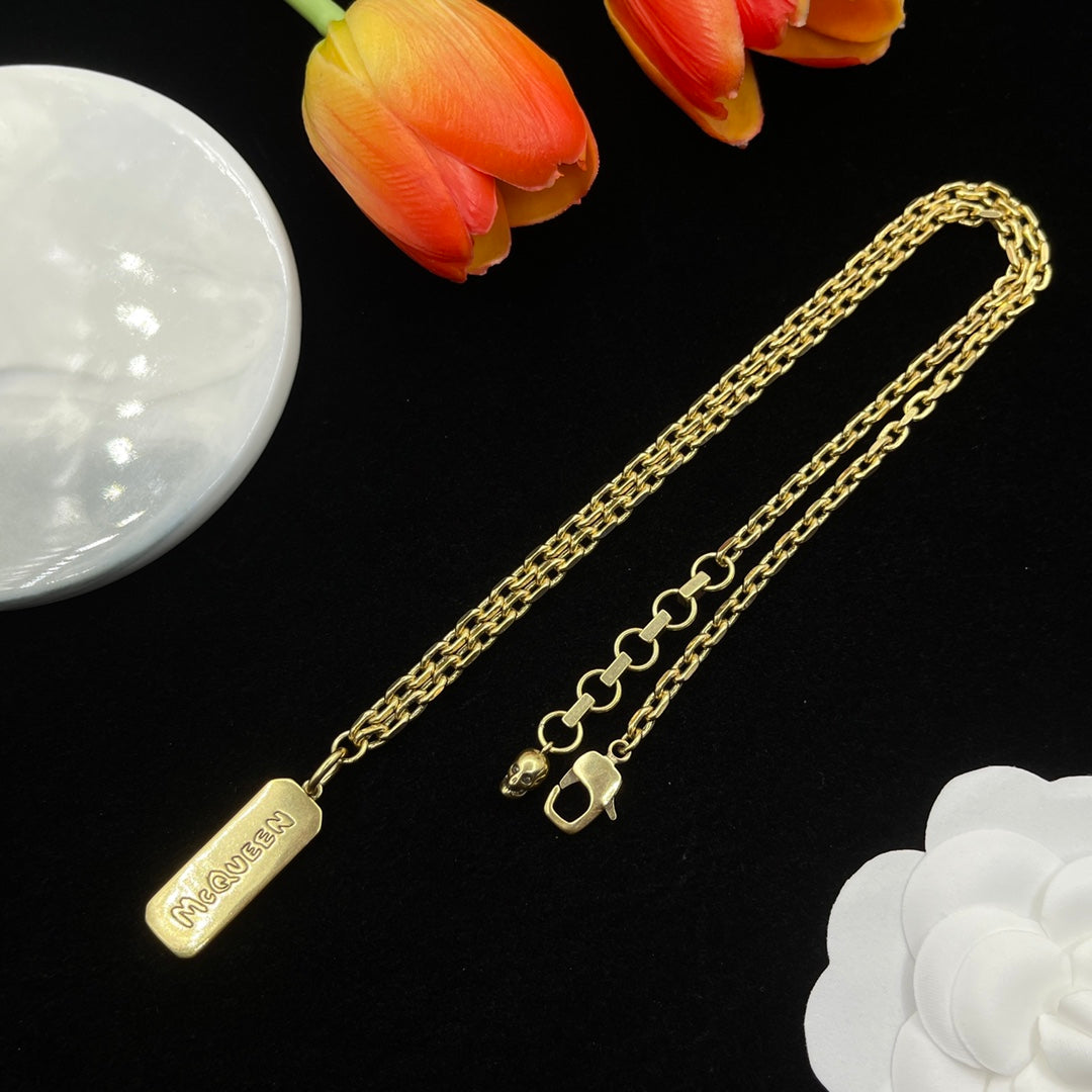 Alexander McQueen Engraved Bar Pendant necklace in Gold Tone, main view