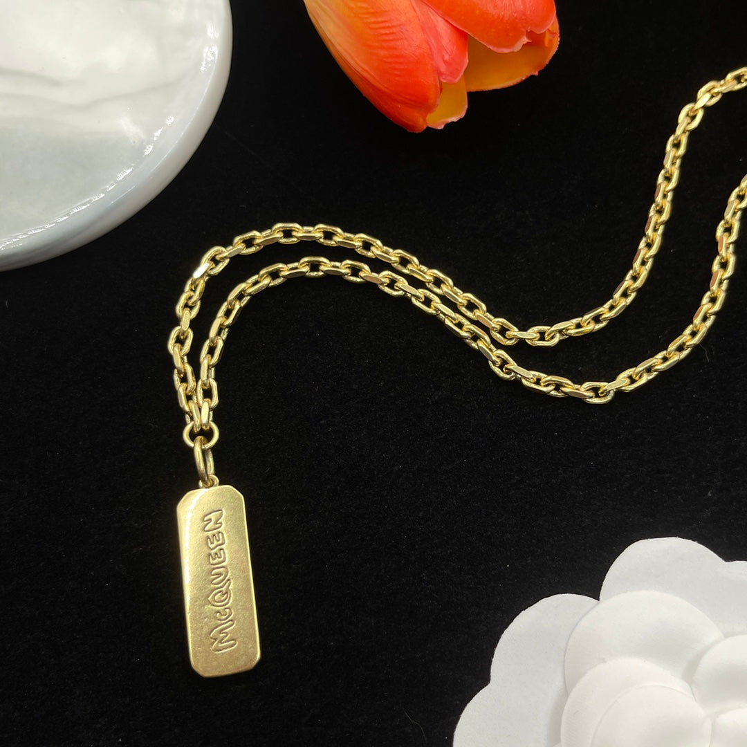 Alexander McQueen Engraved Bar Pendant necklace in Gold Tone, detail view 5