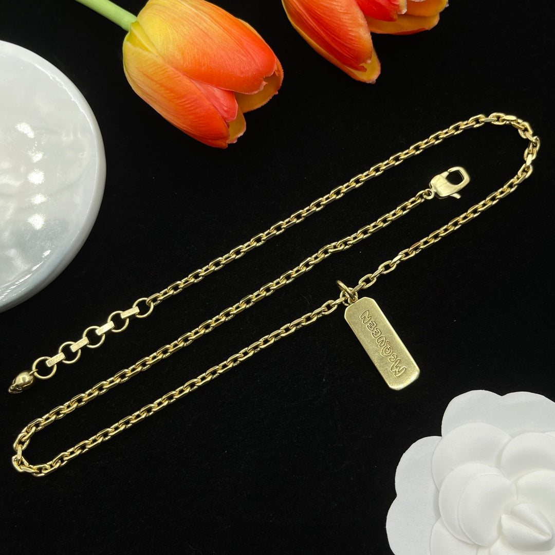 Alexander McQueen Engraved Bar Pendant necklace in Gold Tone, detail view 6