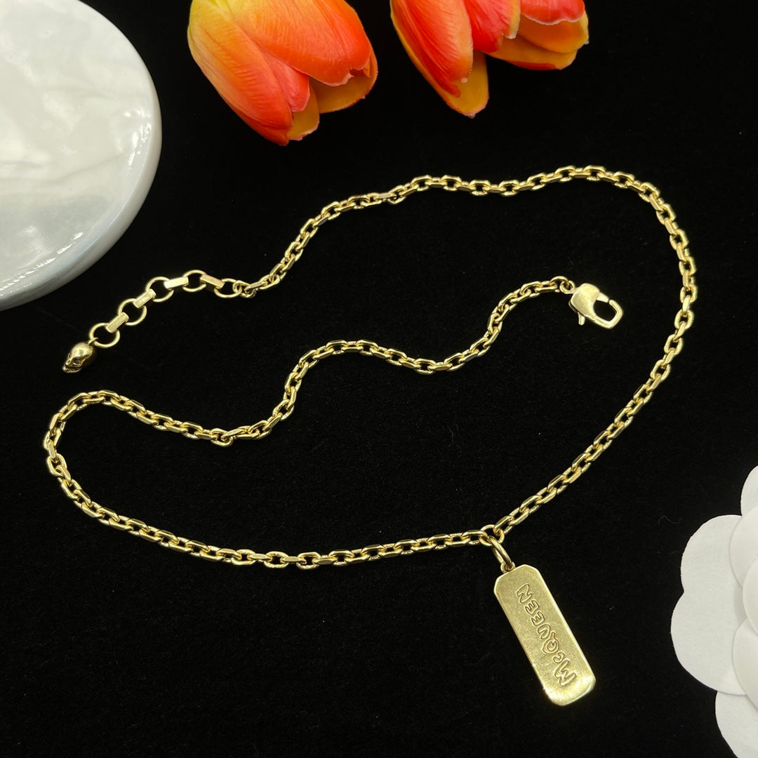 Alexander McQueen Engraved Bar Pendant necklace in Gold Tone, detail view 2