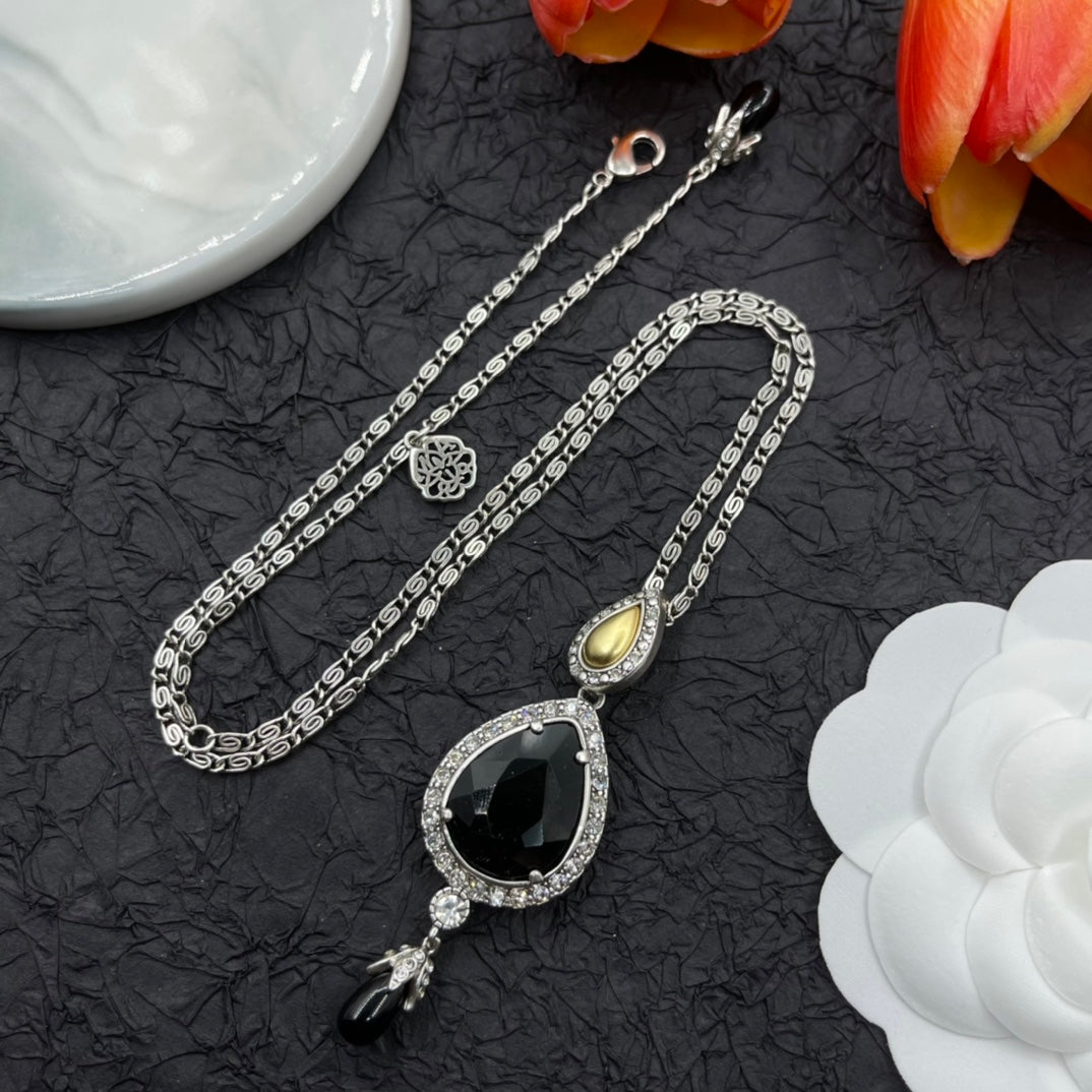 Alexander McQueen Oval Black Crystal Pendant necklace in Gold Tone, main view