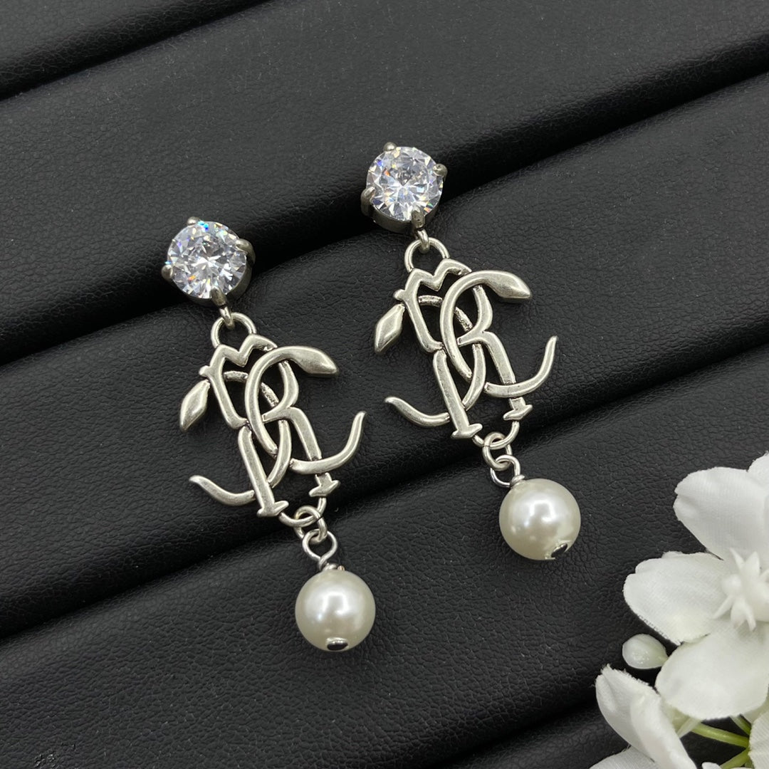 Alexander McQueen Monogram Pearl Drop earrings in Silver Tone, main view
