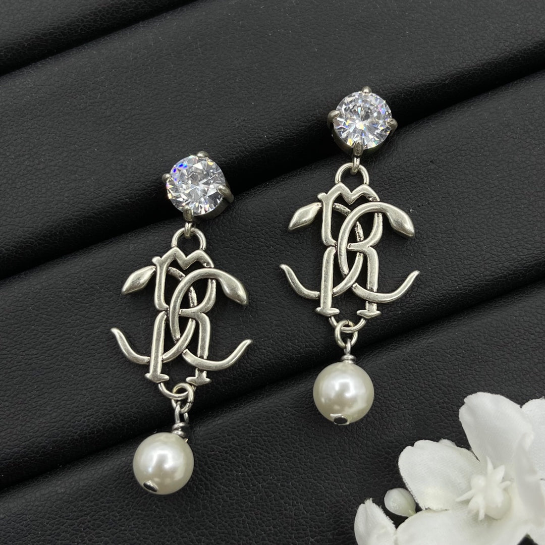 Alexander McQueen Monogram Pearl Drop earrings in Silver Tone, detail view 2