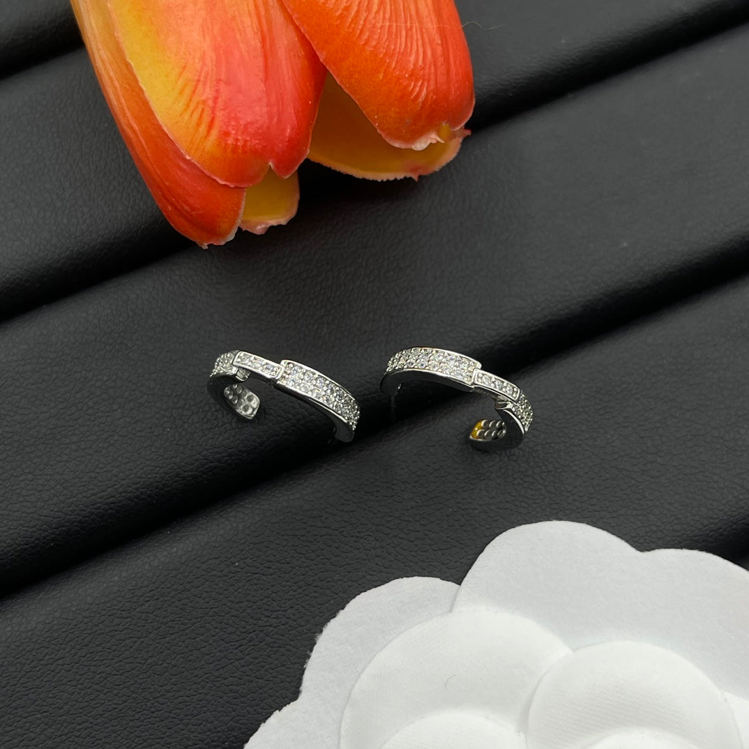 Chaumet pave huggie hoop earrings in Silver Tone, detail view 3
