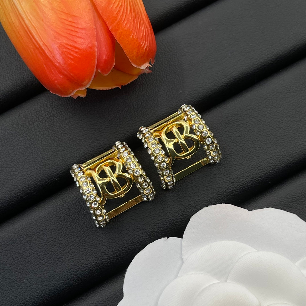Burberry clear crystal frame stud earrings in Gold Tone, main view