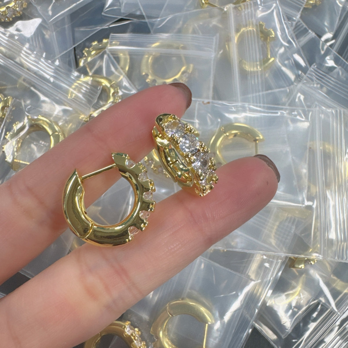 Sif Jakobs graduated crystal huggie hoop earrings in Gold Tone, detail view 17