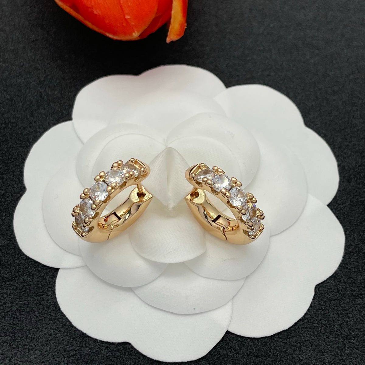 Sif Jakobs graduated crystal huggie hoop earrings in Gold Tone, detail view 3