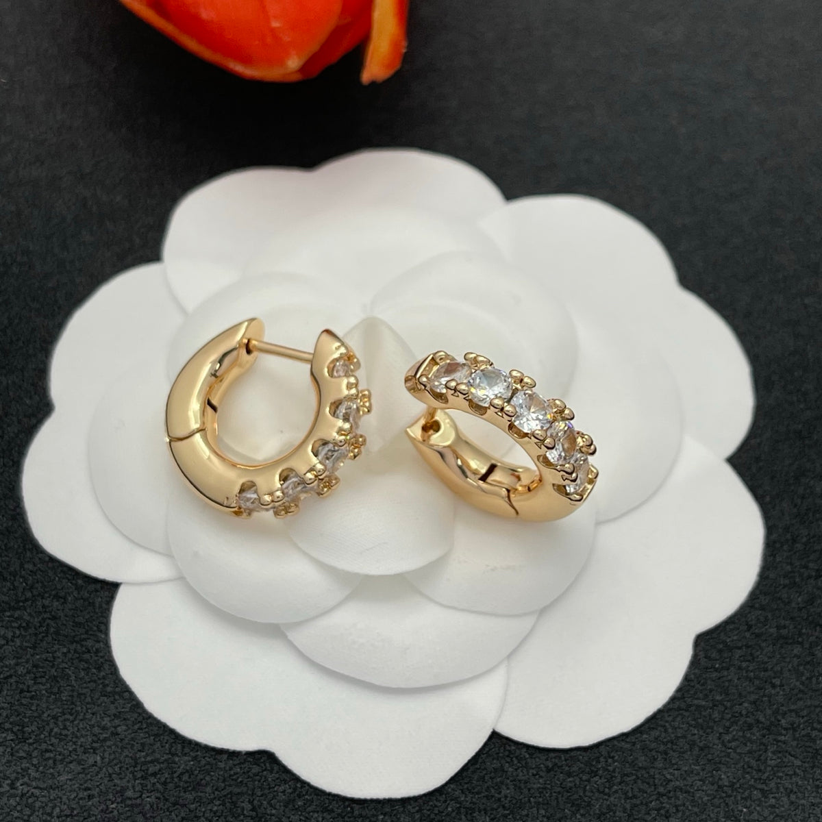 Sif Jakobs graduated crystal huggie hoop earrings in Gold Tone, detail view 2