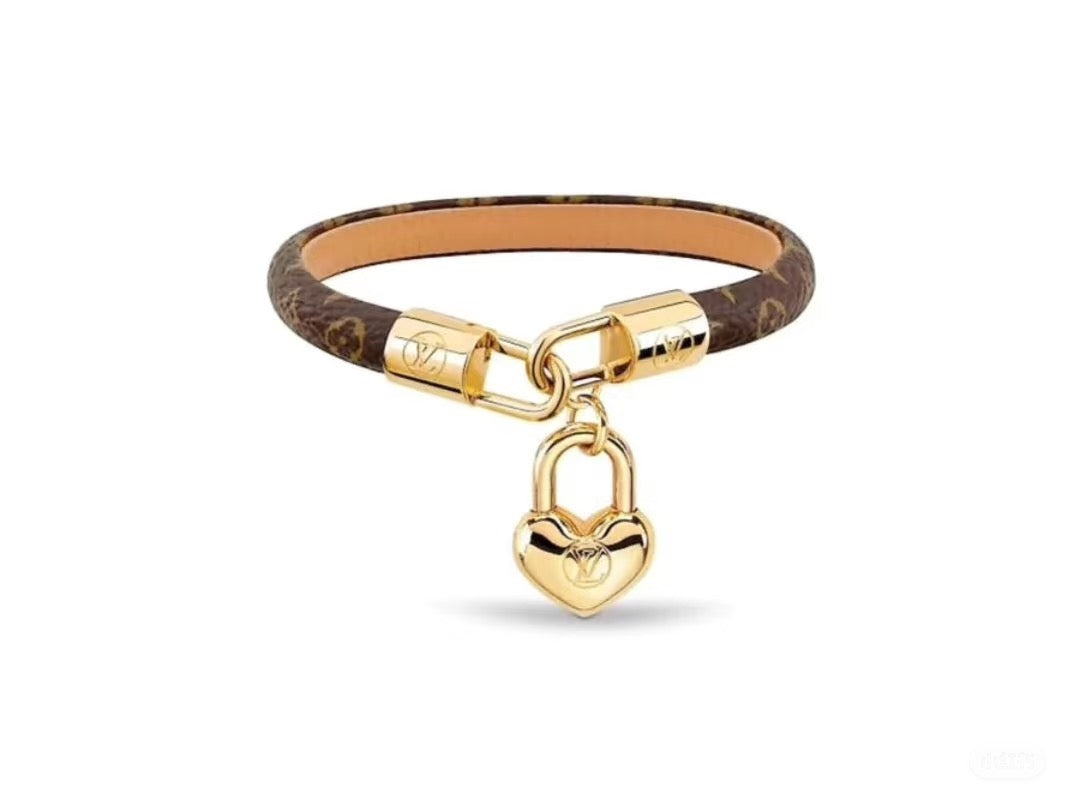 Louis Vuitton Leather Gold-Tone Fashion Accessory – Style 14 - image 1